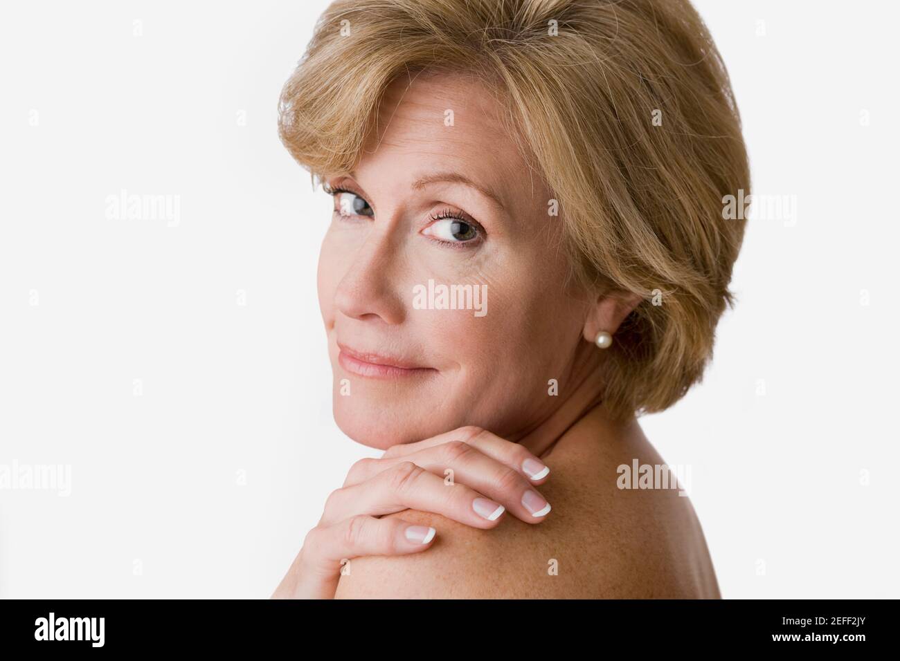 Portrait of a mature woman smiling Stock Photo