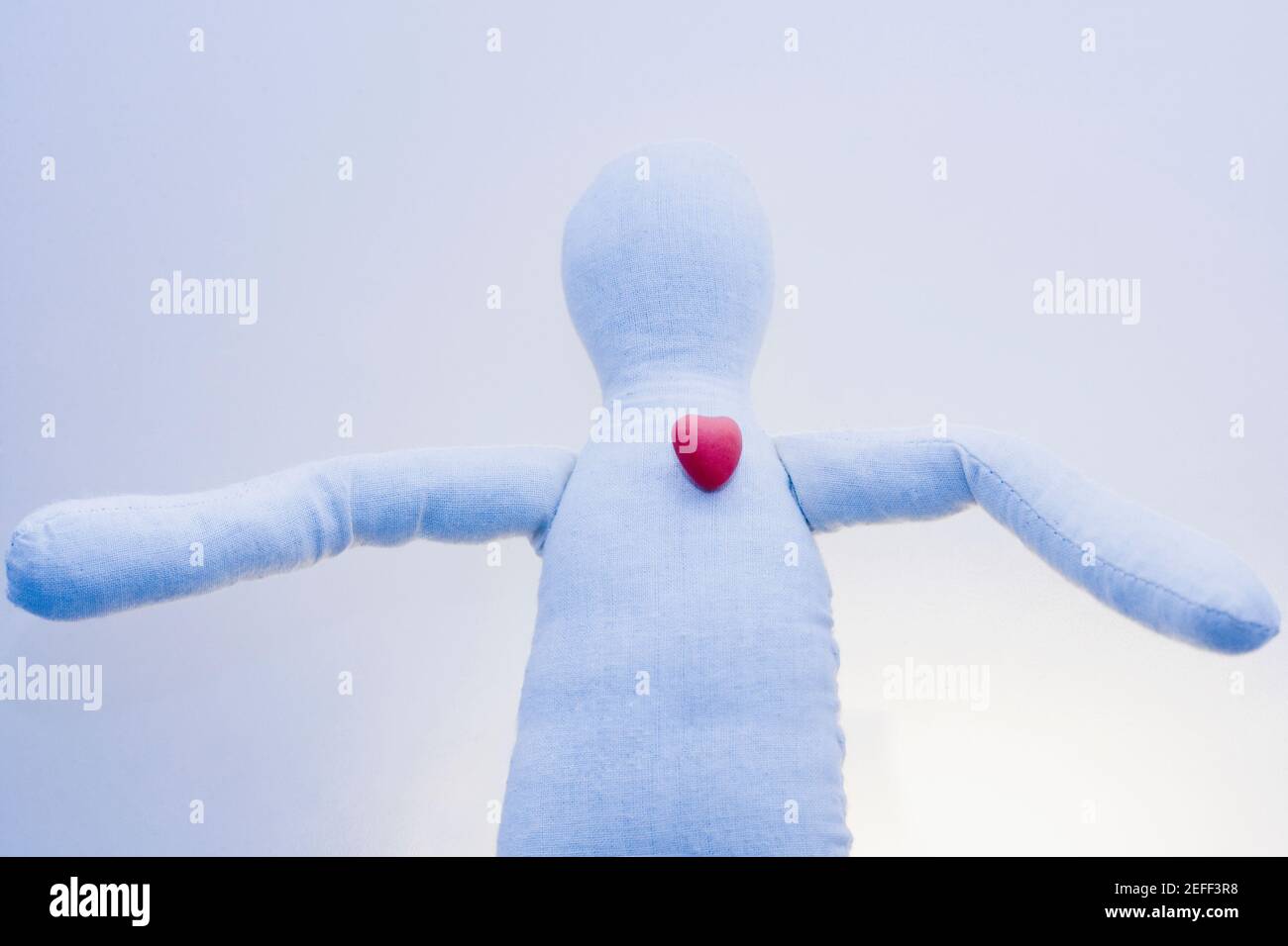 Close-up of a stuffed toy with a heart shaped candy on it Stock Photo