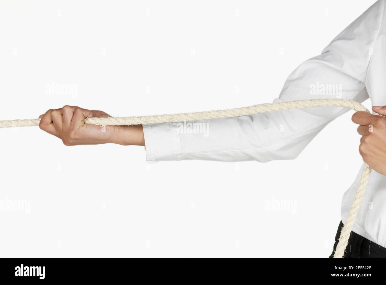 People pulling rope, close-up stock photo