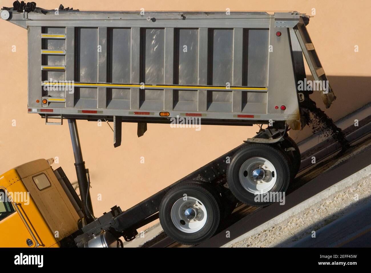 Dump truck dumping concrete Stock Photo Alamy