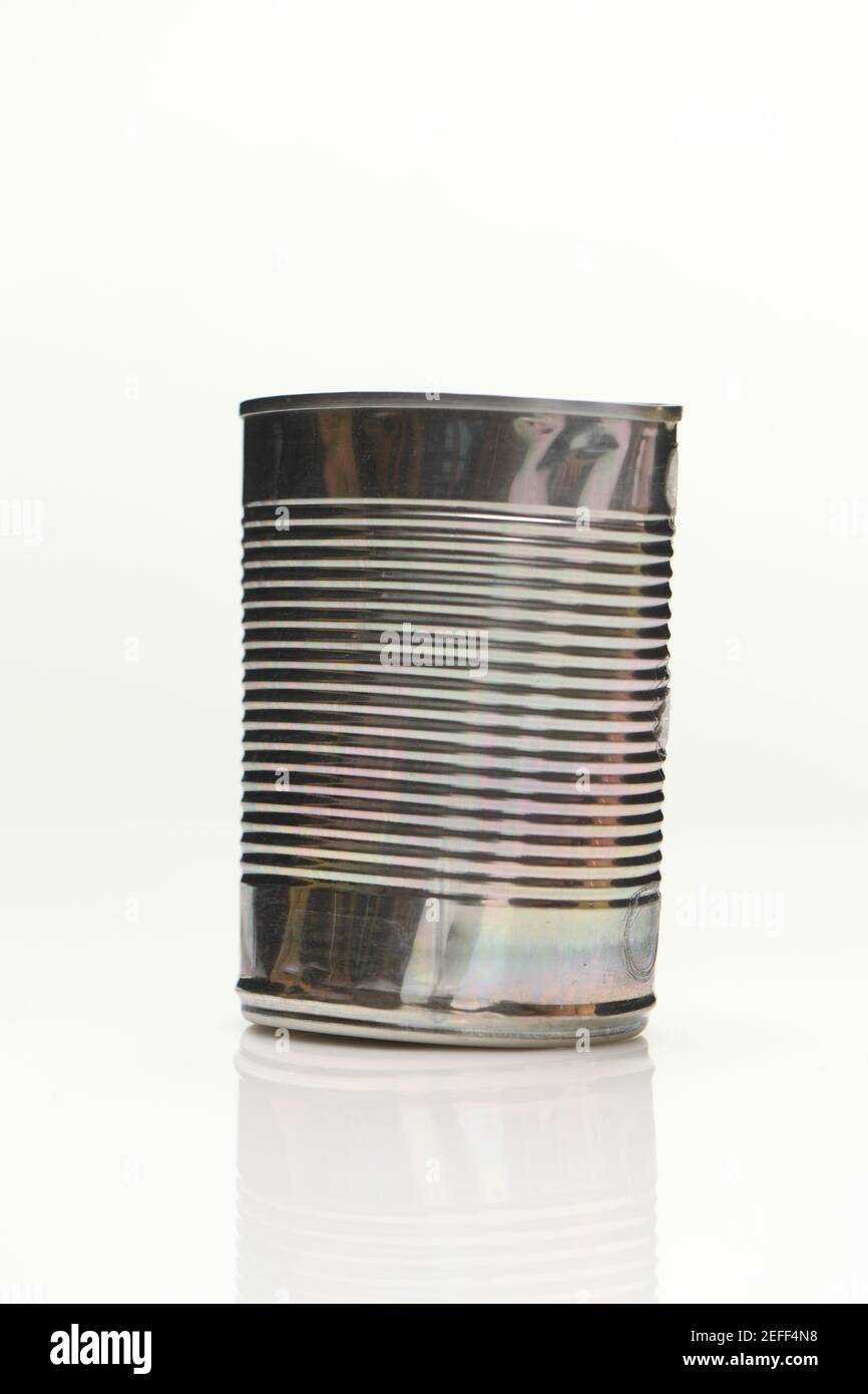 De-labelled Aluminium food cans shot on white background with reflection Stock Photo