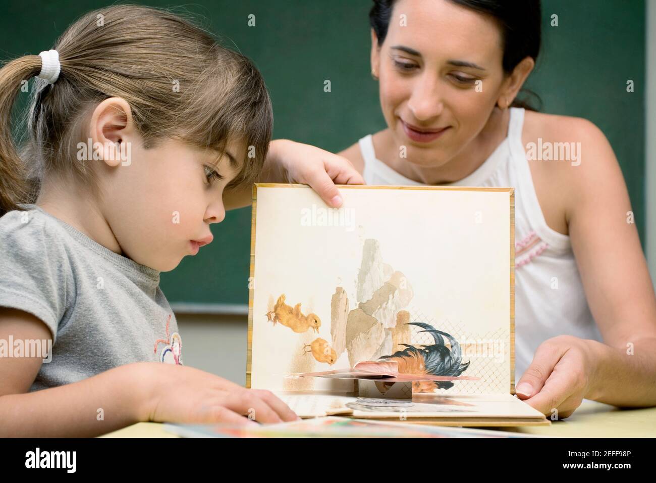 Female teacher teaching her student in a classroom Stock Photo Alamy