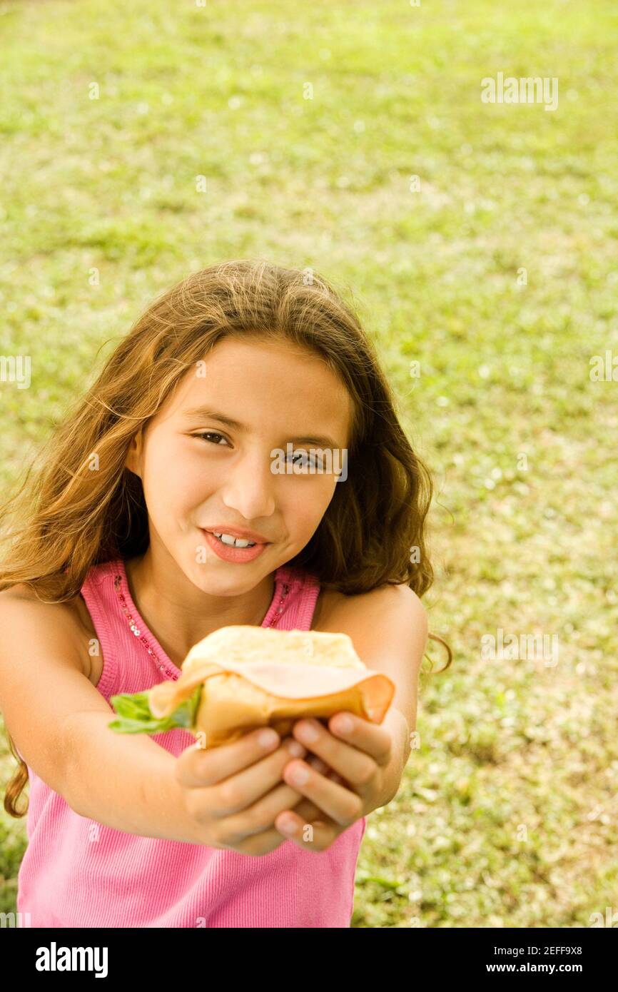 Close-up of a girl holding a burger Stock Photo