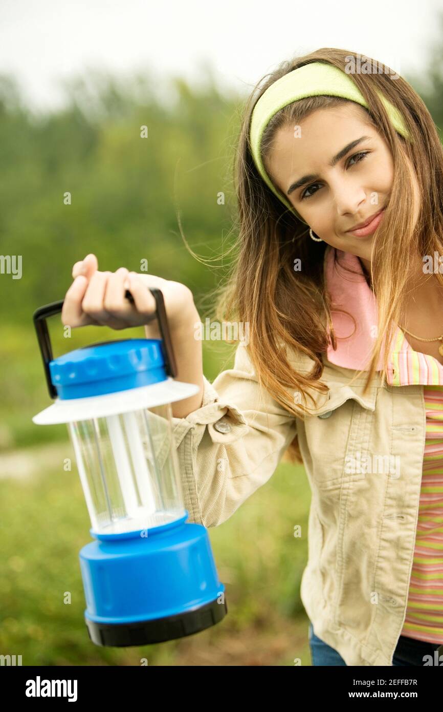 Girl holding a lantern hires stock photography and images Alamy