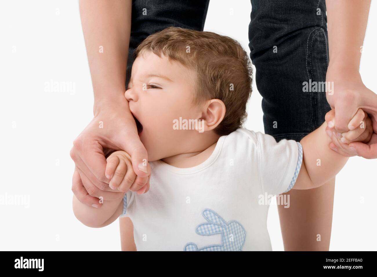 Low section view of a woman holding her babyÅ½s hands Stock Photo