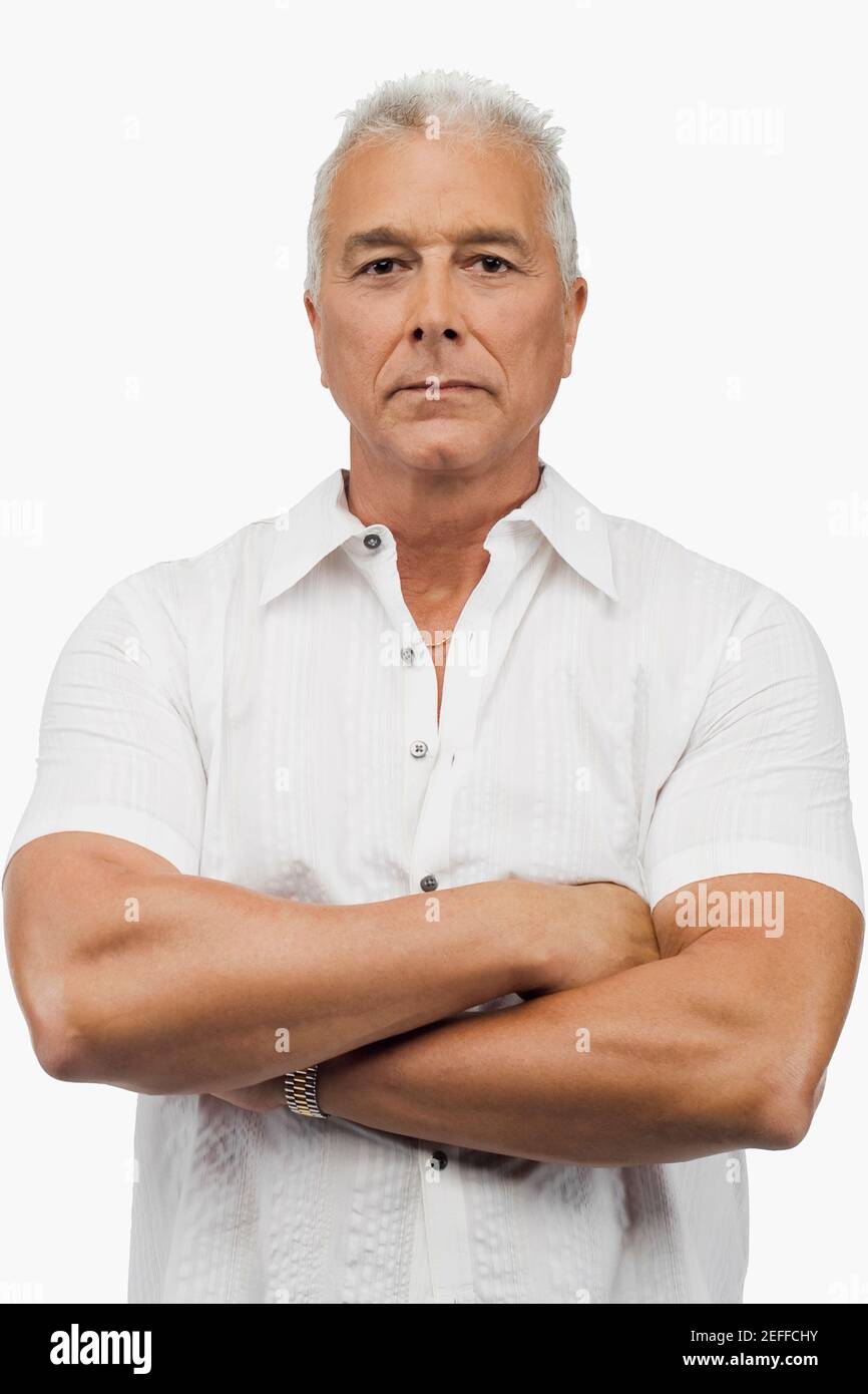 Portrait of a senior man standing with his arms crossed Stock Photo - Alamy