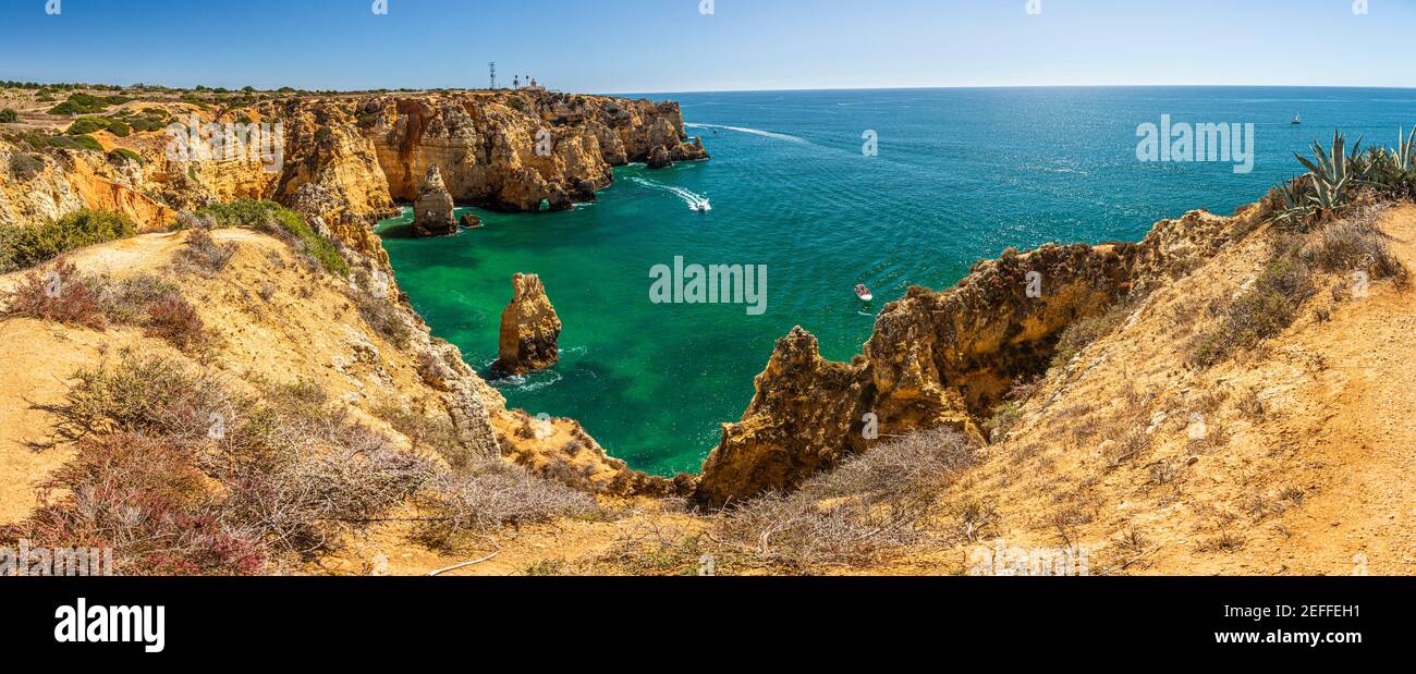 View on typical cliffy beach at Algarve coastline in Portugal Stock Photo