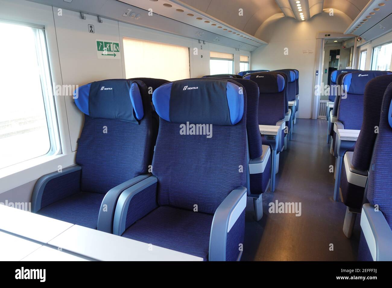 Rome, Italy - May 19, 2017:Empty train interior seats during travel. Euro star high speed train of Trenitalia major italian railway company. Stock Photo