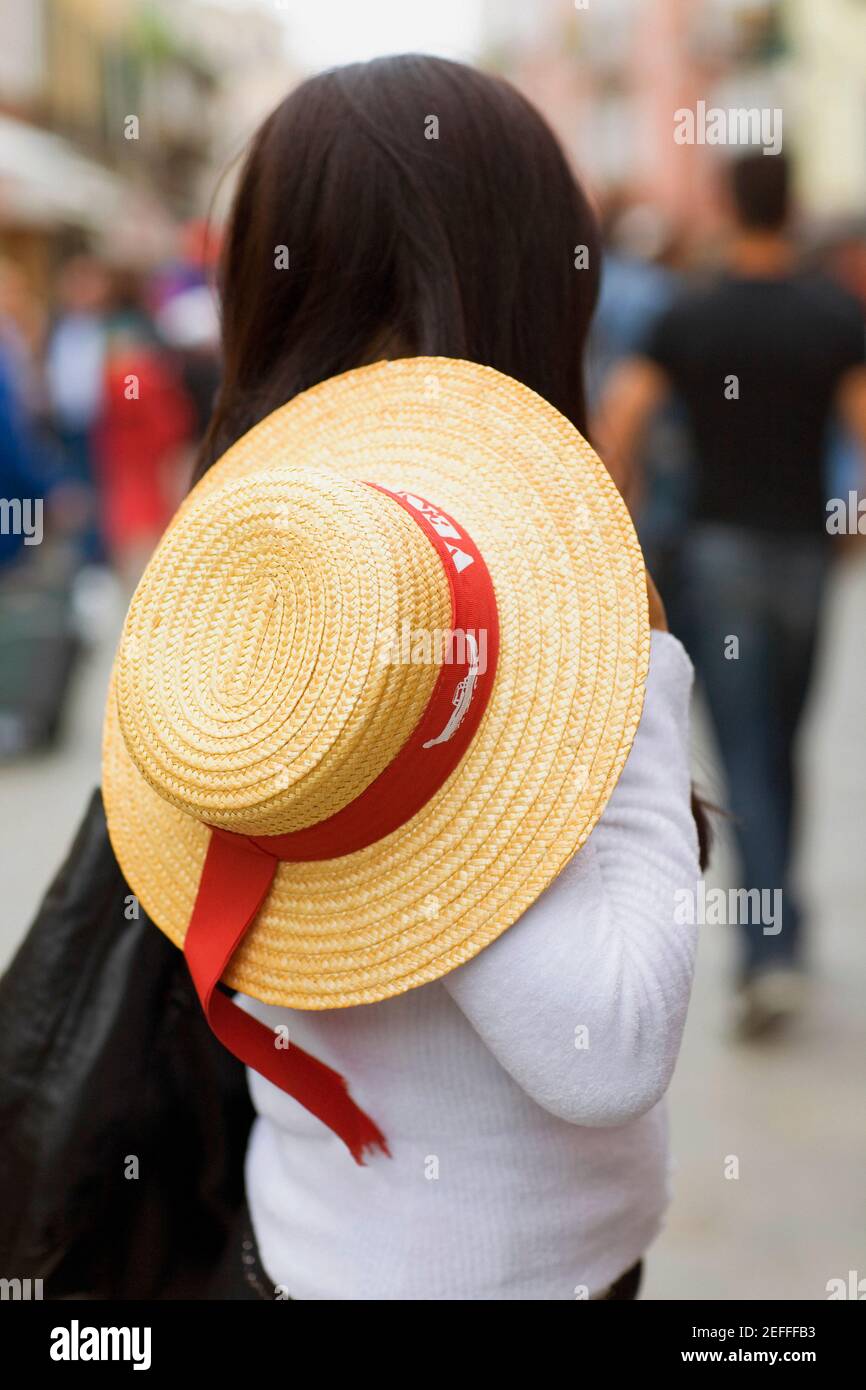 Side profile of a woman holding a hat Stock Photo