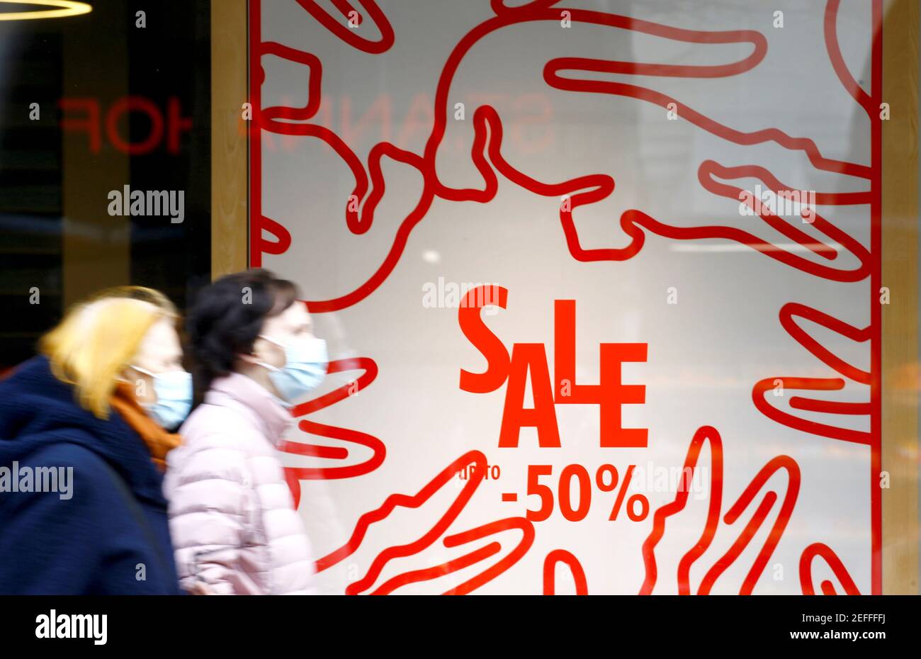 Posters offering special discount on sales are seen at a Lacoste store, as  the spread of the coronavirus disease (COVID-19) continues, at the  Bahnhofstrasse shopping street in Zurich, Switzerland February 17, 2021.