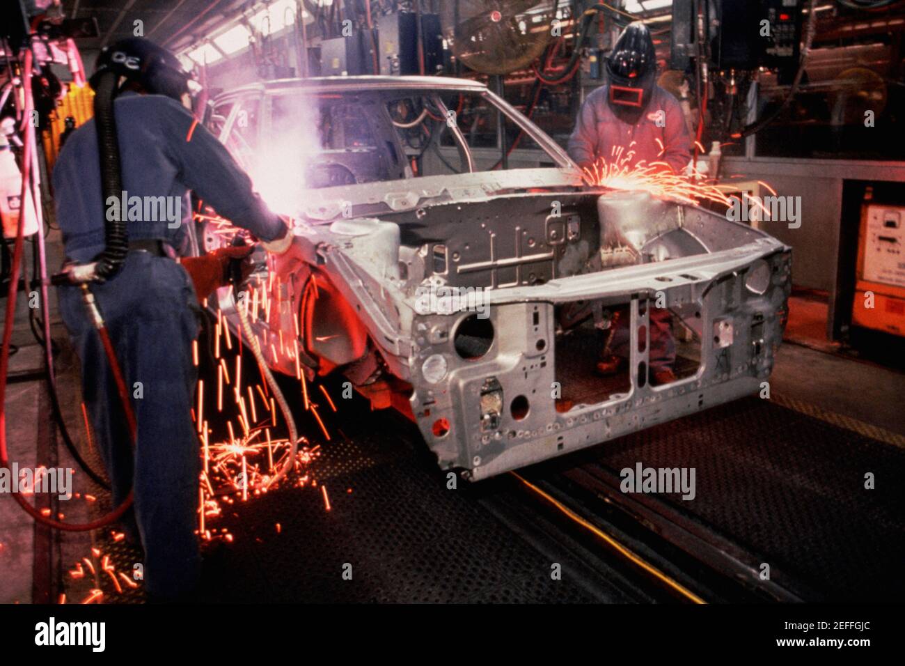 Workers weld car bodies, Chrysler plant, Newark, Delaware Stock Photo