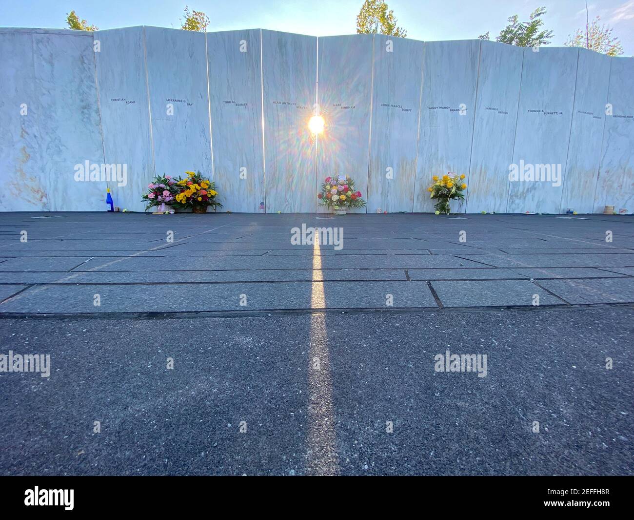 Flowers in front of names of those who died at Flight 93 Memorial