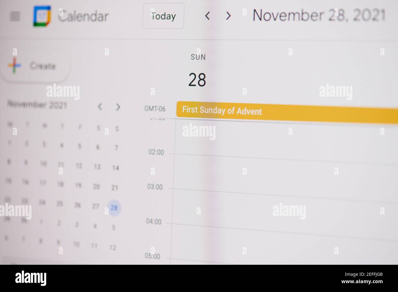New york, USA - February 17, 2021: 31 First sunday advent 28 of November on google calendar on laptop screen close up view. Stock Photo