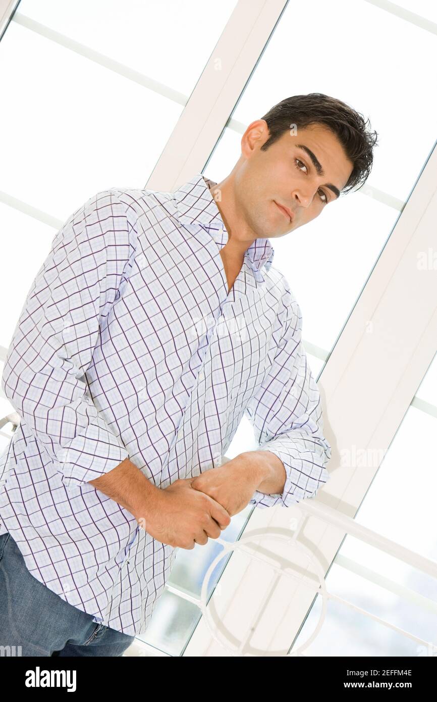 Portrait of a young man standing Stock Photo - Alamy