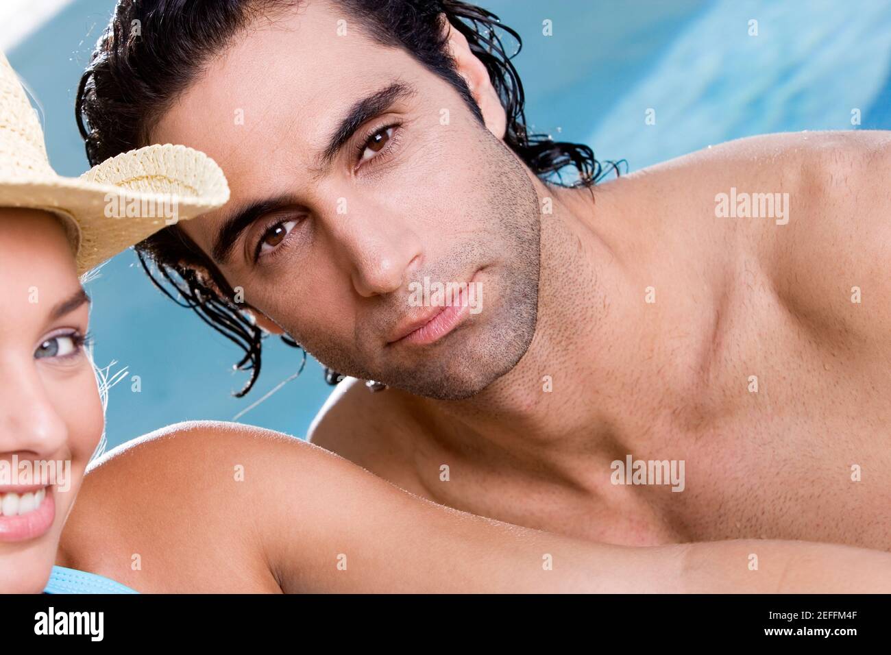 Portrait of a young woman and a mid adult man smiling Stock Photo - Alamy