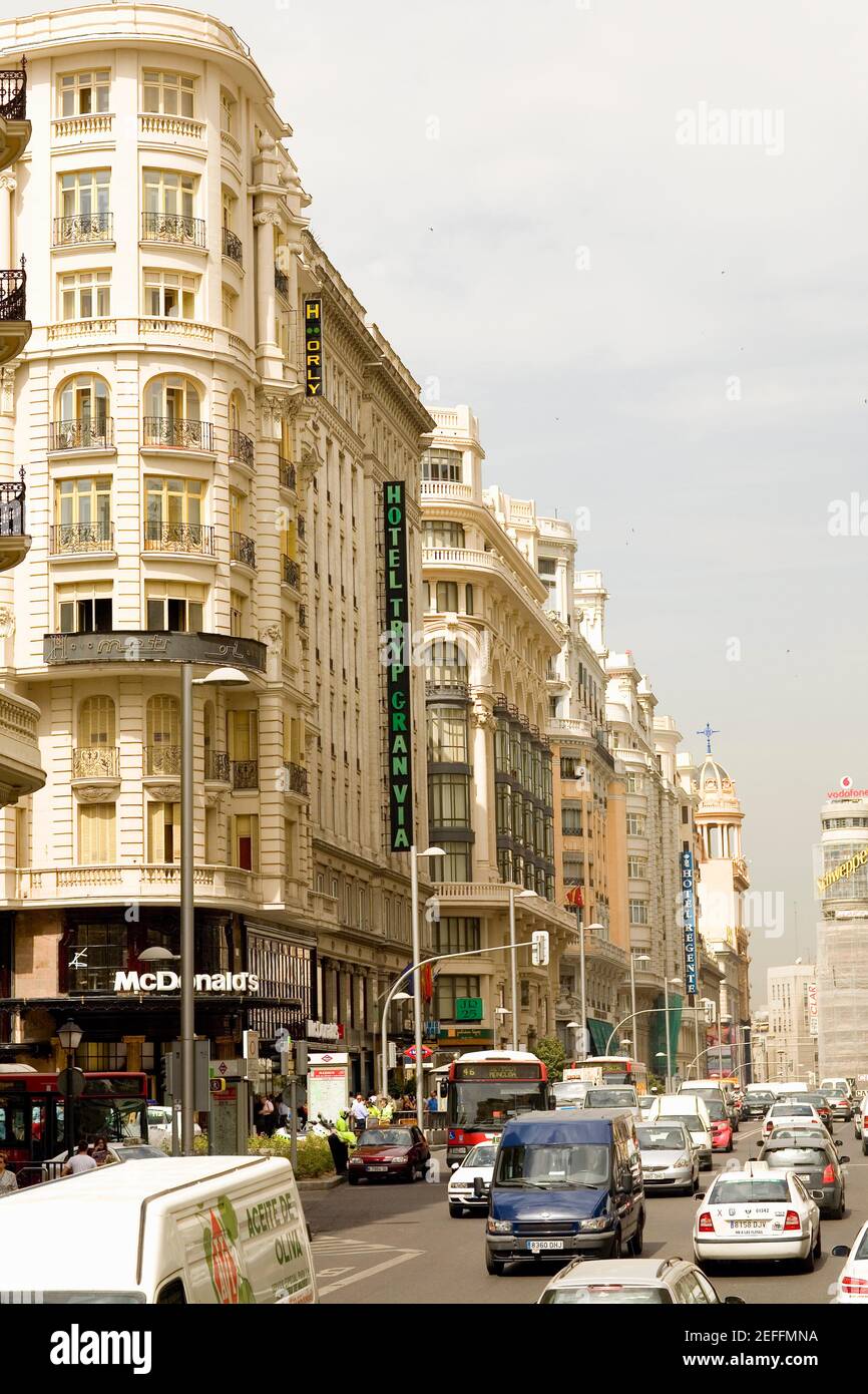 Traffic on a road in front of a hotel, TRYP Gran Via Hotel, Gran Via, Madrid, Spain Stock Photo