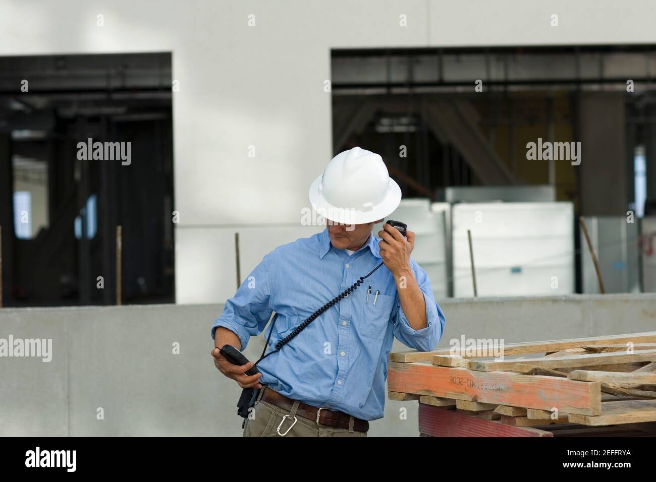 Male construction worker talking on a CB radio Stock Photo Alamy