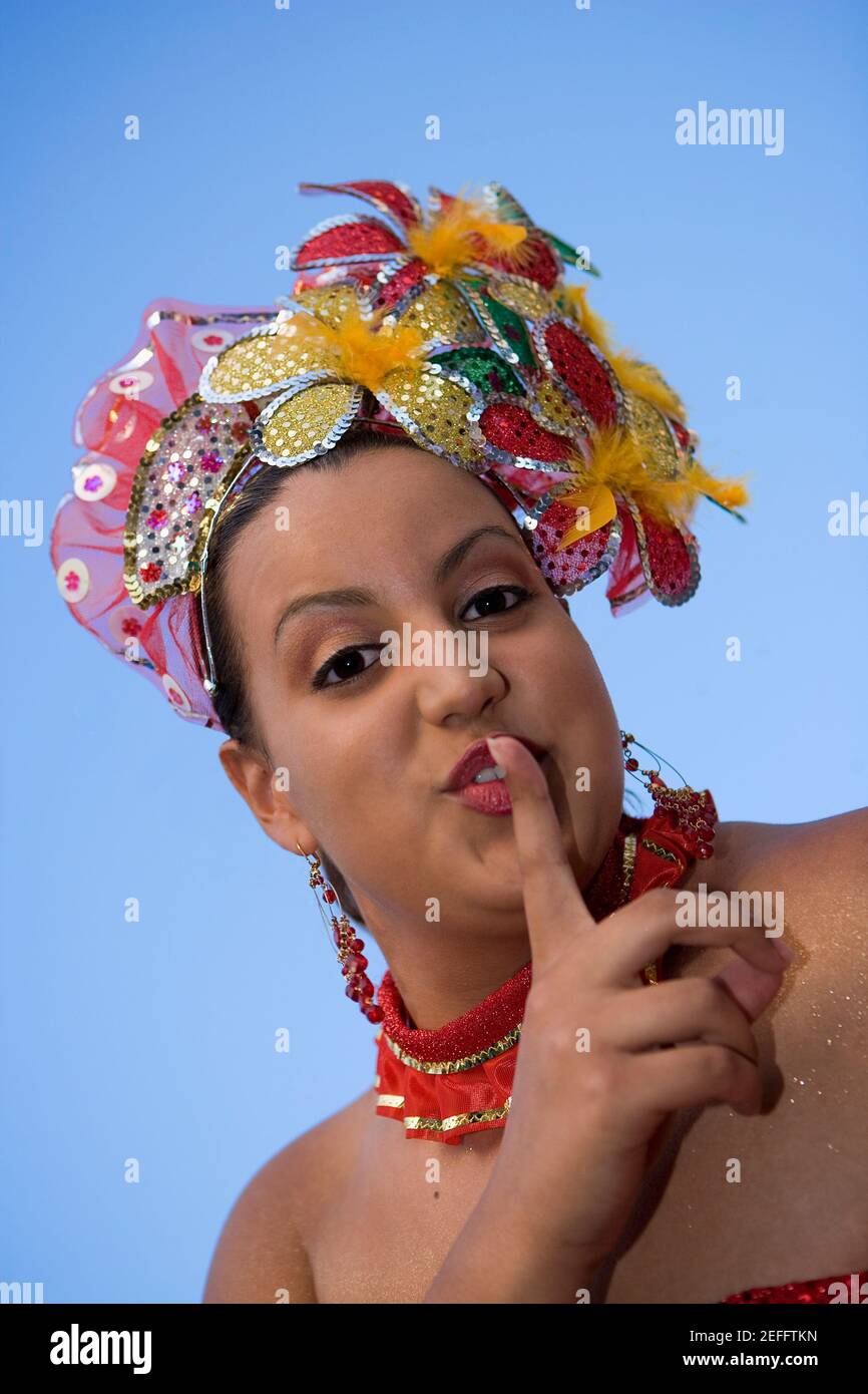 Portrait of a teenage girl with her finger on her lips Stock Photo - Alamy