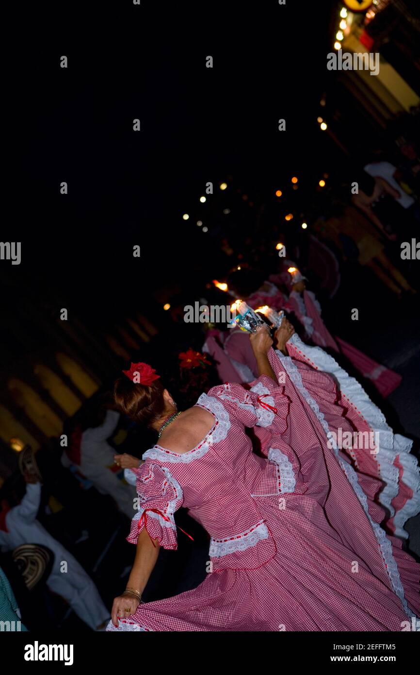 Rear view of a woman dancing in a traditional festival Stock Photo