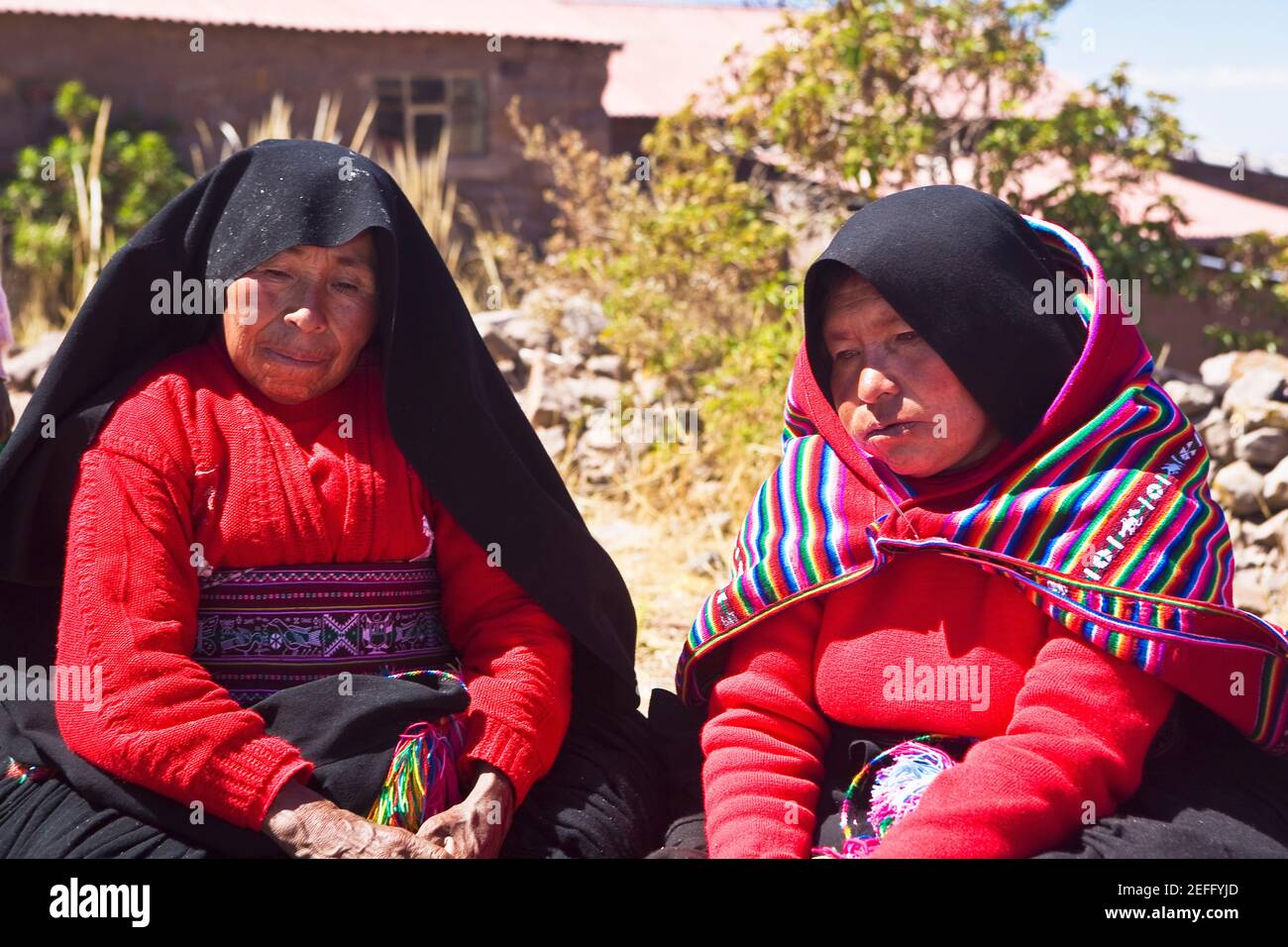 Closeup of two mature women taking part in a wedding ceremony, Taquile