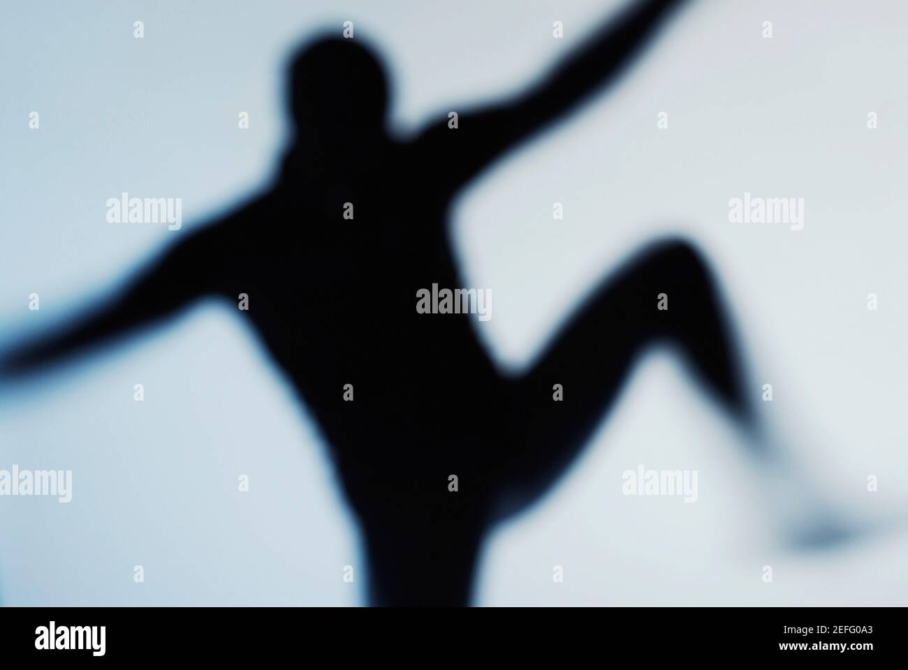 Silhouette of a person dancing Stock Photo