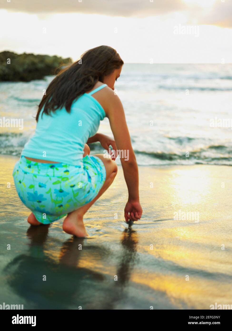 Girl crouching down rear hi-res stock photography and images - Alamy