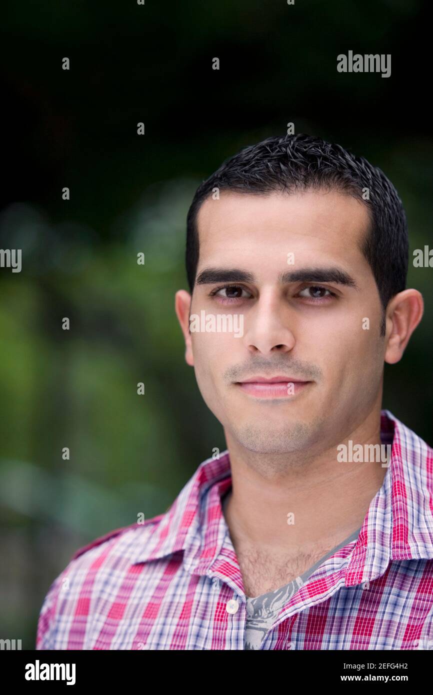Portrait of a young man smiling Stock Photo - Alamy