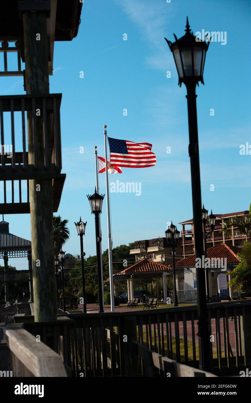 Lampposts near an American flag, Cocoa, Florida, USA Stock Photo