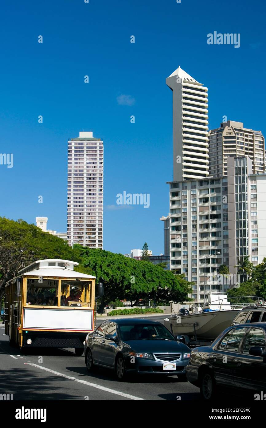Traffic on the road with skyscrapers in the background, Honolulu, Oahu, Hawaii Islands, USA Stock Photo