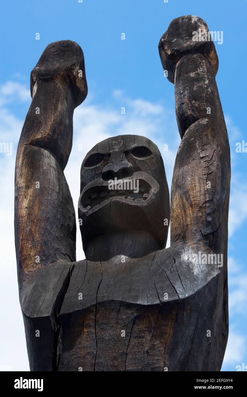 Low angle view of a wooden statue, Ahuena Heiau, Kailua-Kona, Kona, Big Island, Hawaii Islands, USA Stock Photo