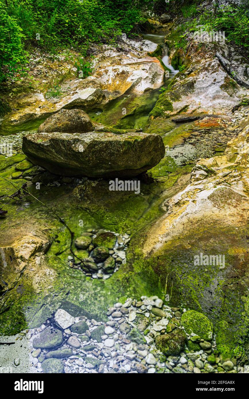 Huge boulder in the bed of a mountain river. Stock Photo