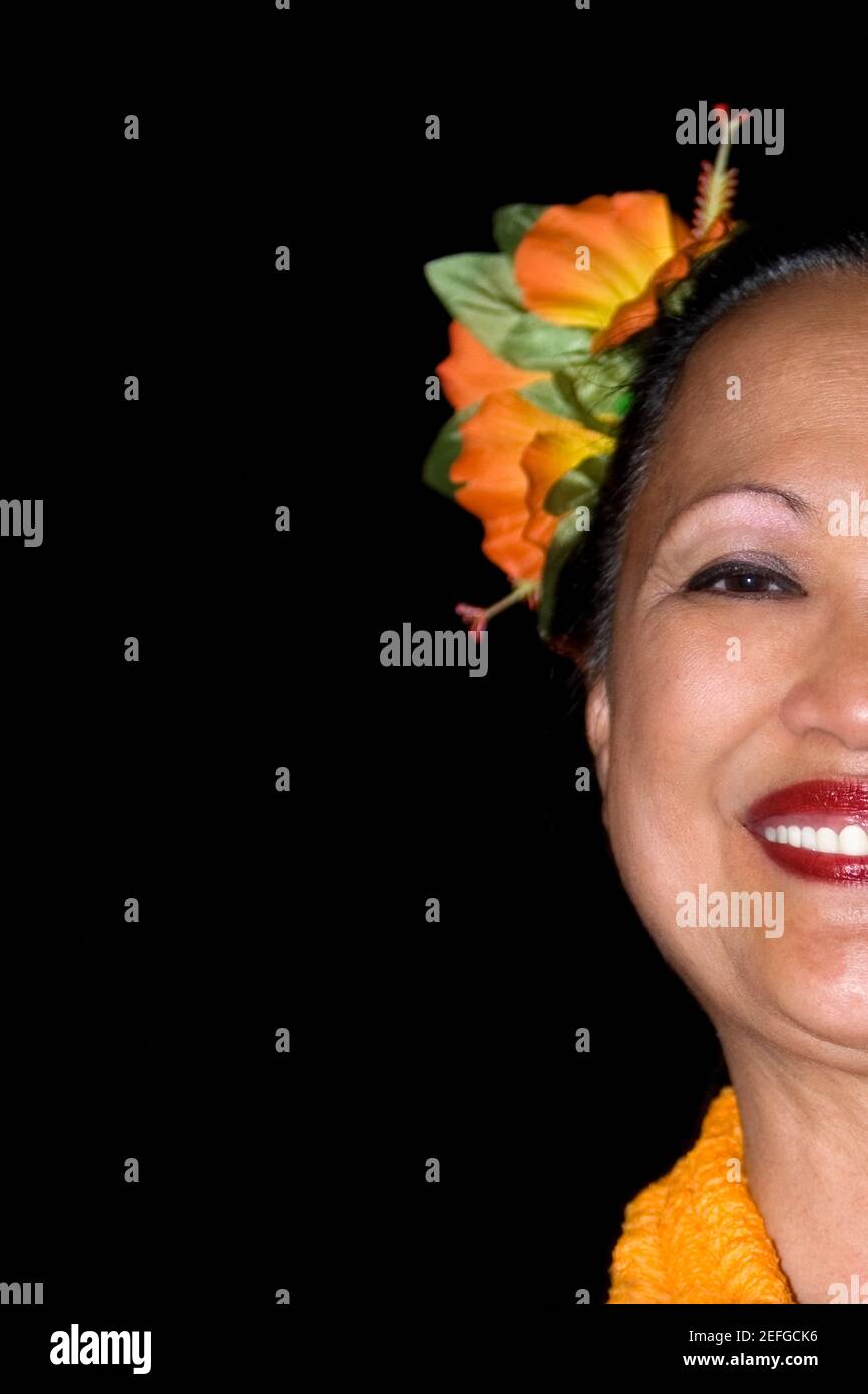 Portrait of a mature woman wearing flowers and smiling Stock Photo - Alamy