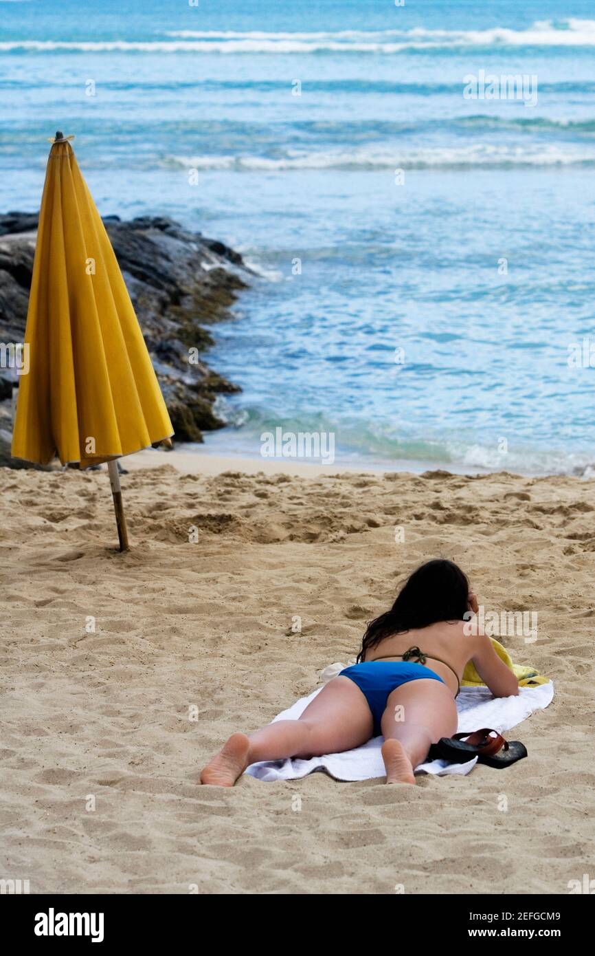 Rear View Of A Woman Lying On The Beach Waikiki Beach Honolulu Oahu Hawaii Islands Usa