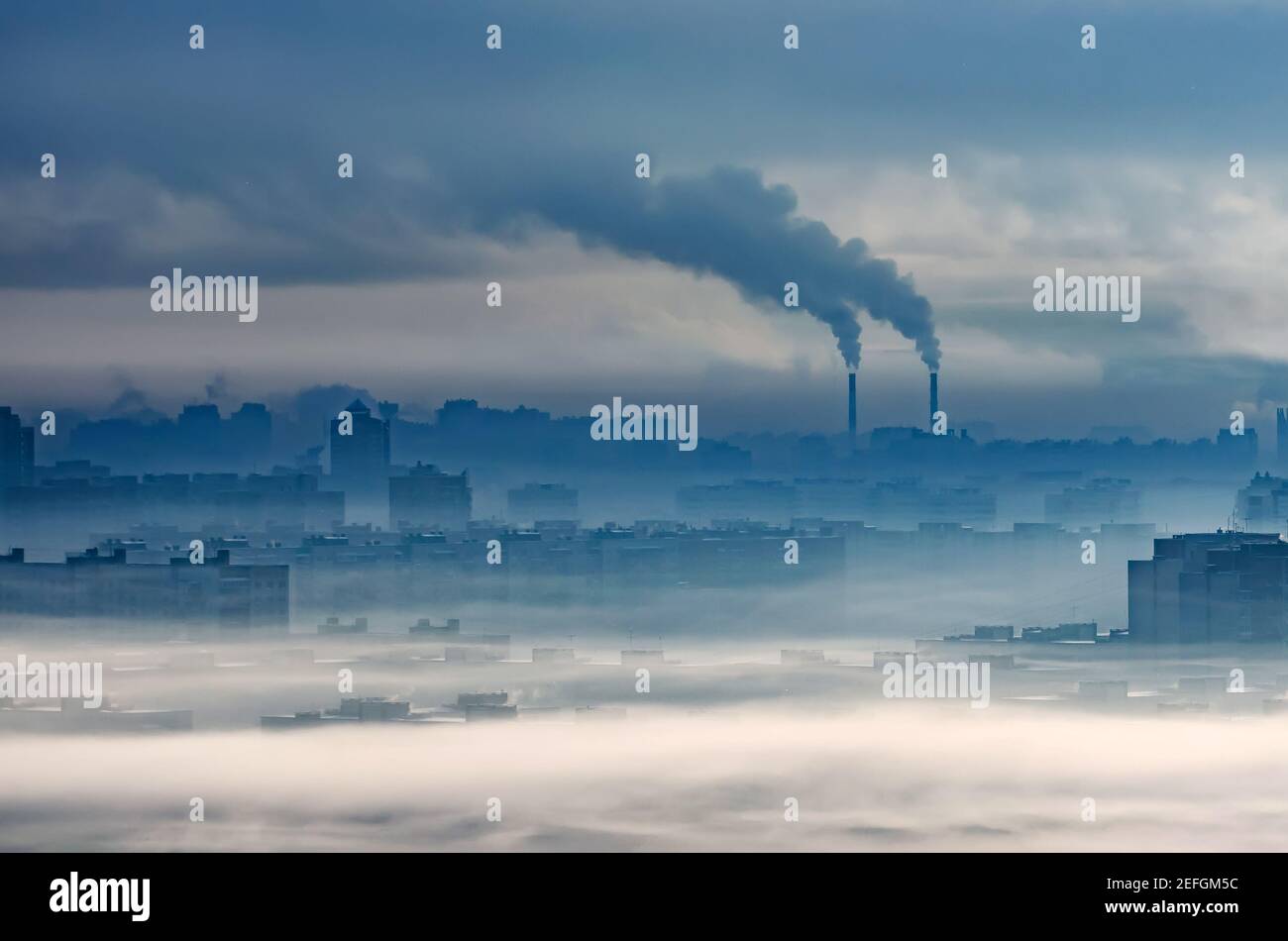 Plant emits smoke smog chimneys in cloudy fog, pollutants released into atmosphere. Ecological catastrophy, harmful emissions and exhaust fumes. Chemi Stock Photo