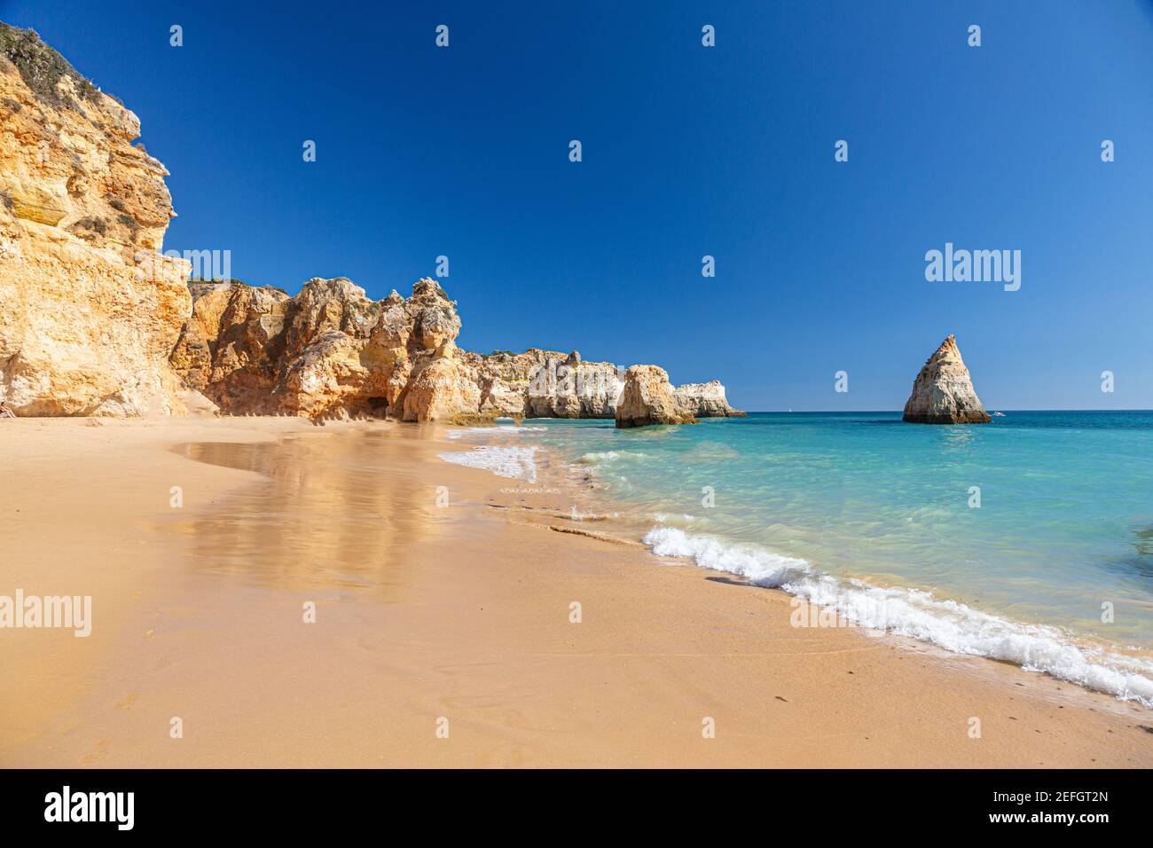 View on typical cliffy beach at Algarve coastline in Portugal Stock Photo
