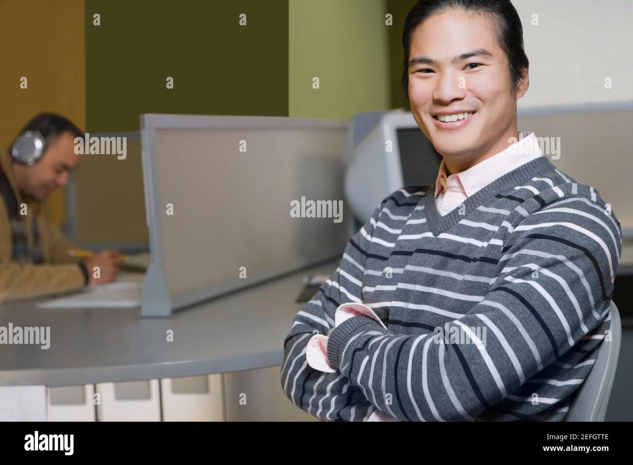 Portrait of a young man in a computer lab Stock Photo - Alamy