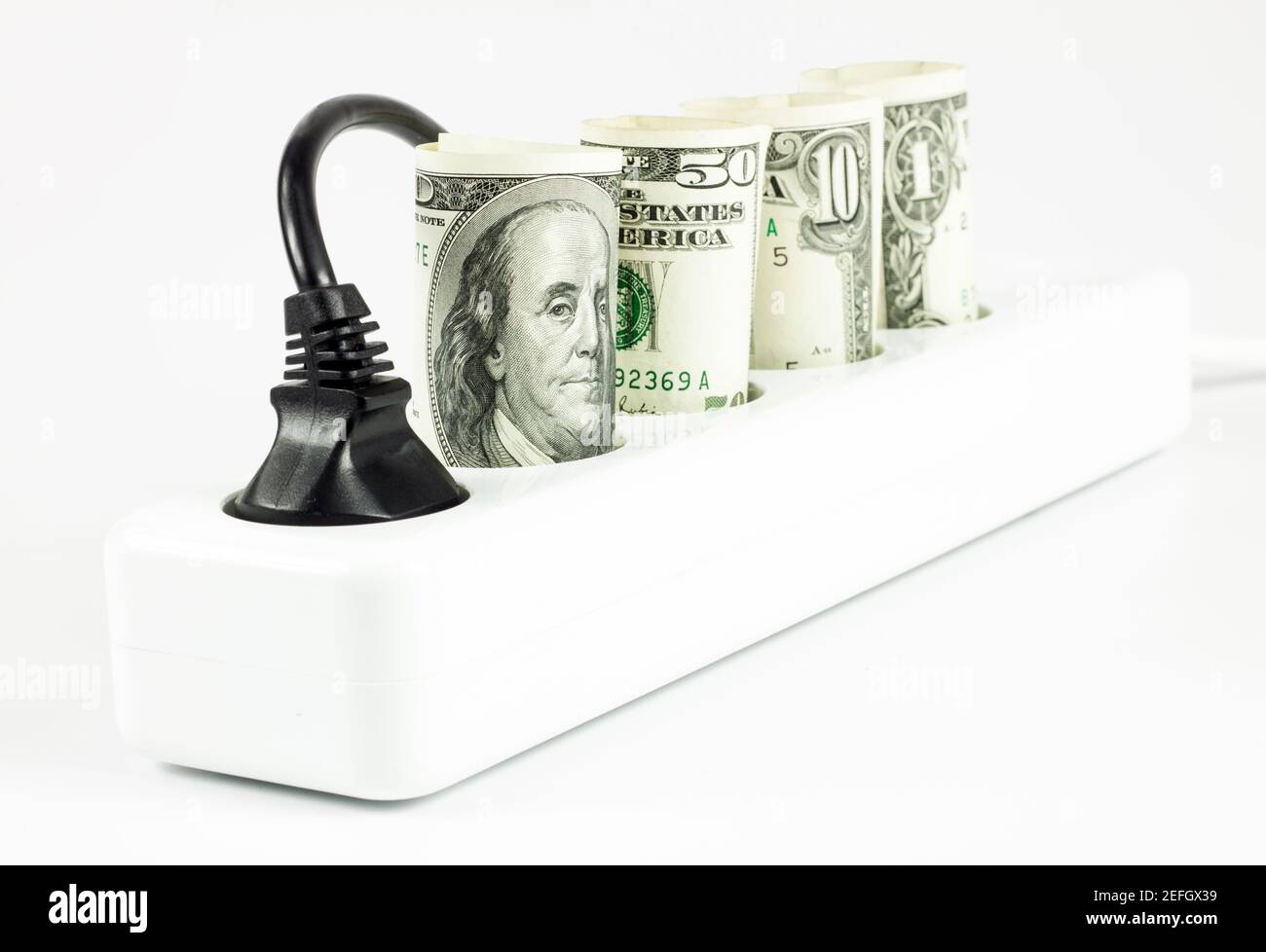 Power cord and us dollars, concept of expensive energy bills Stock Photo