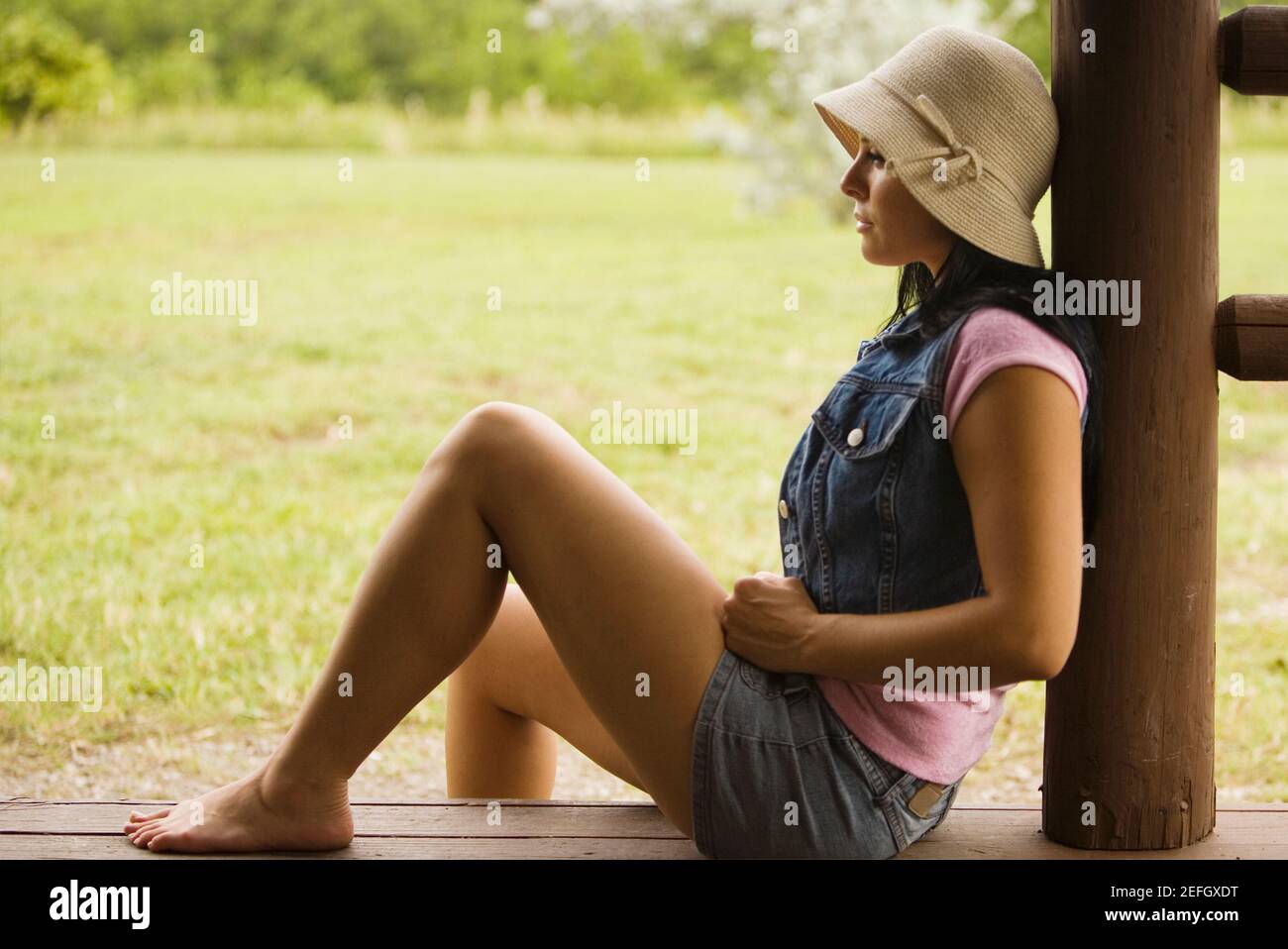 Woman sitting on her porch hi-res stock photography and images - Alamy