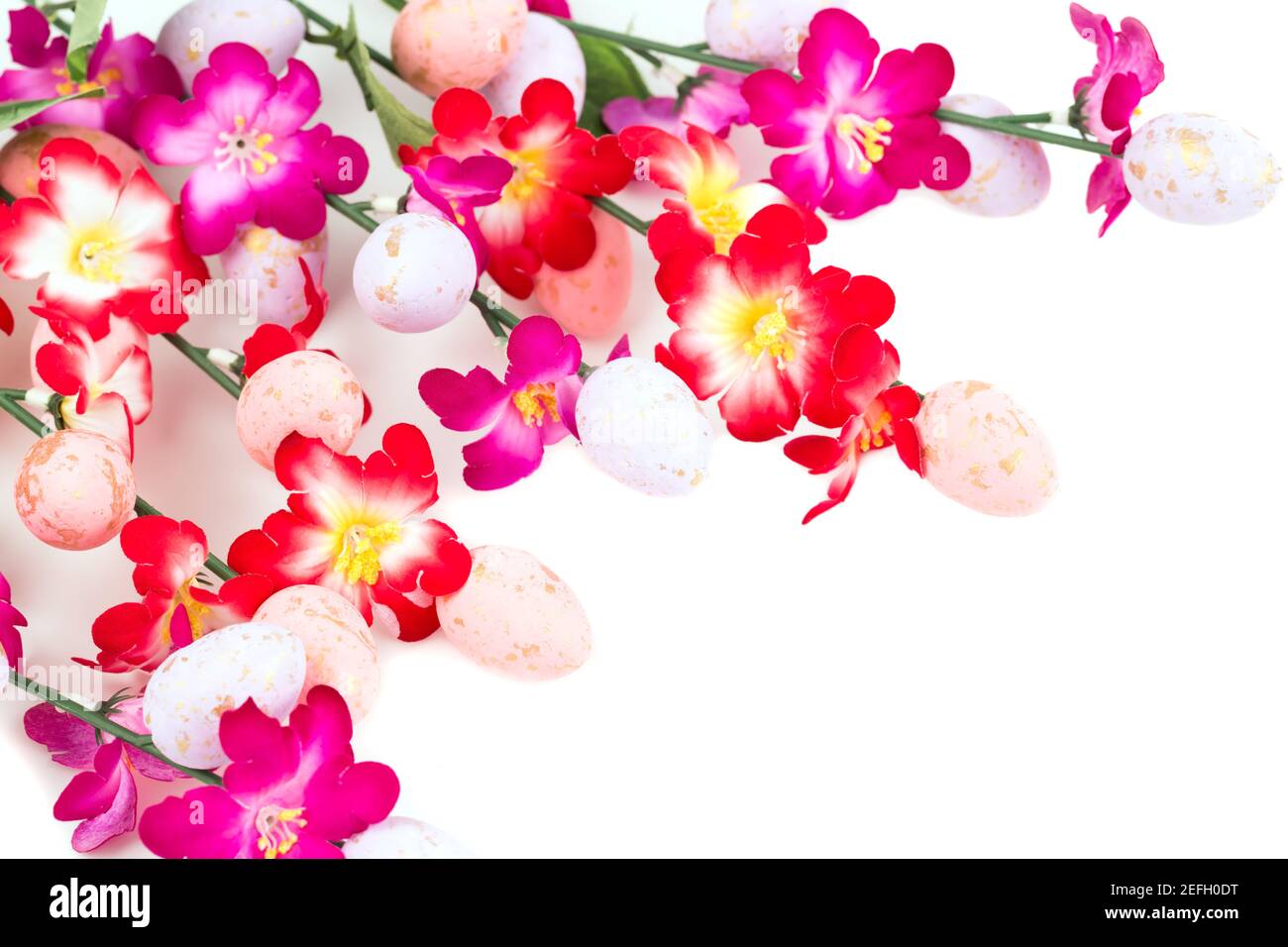 Easter colorful eggs and flowers on white background Stock Photo - Alamy