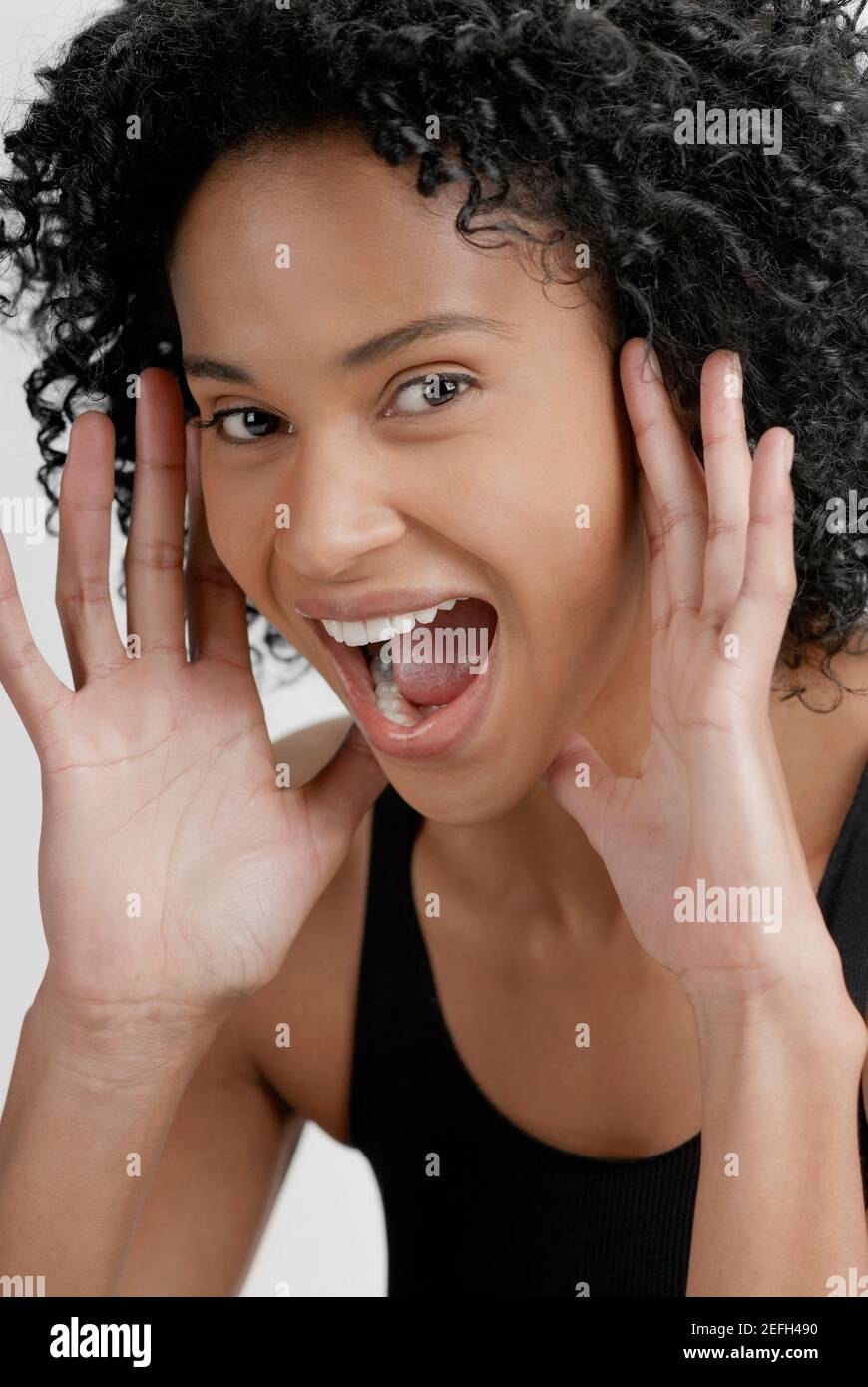 Portrait of a young woman shouting Stock Photo