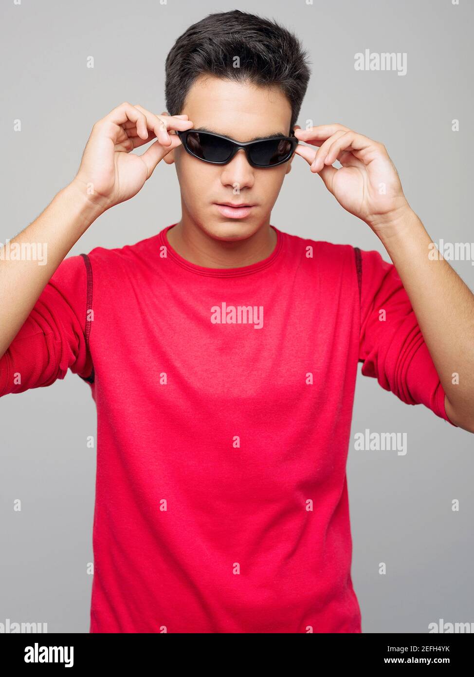 Young latin man wearing black hi-res stock photography and images - Alamy