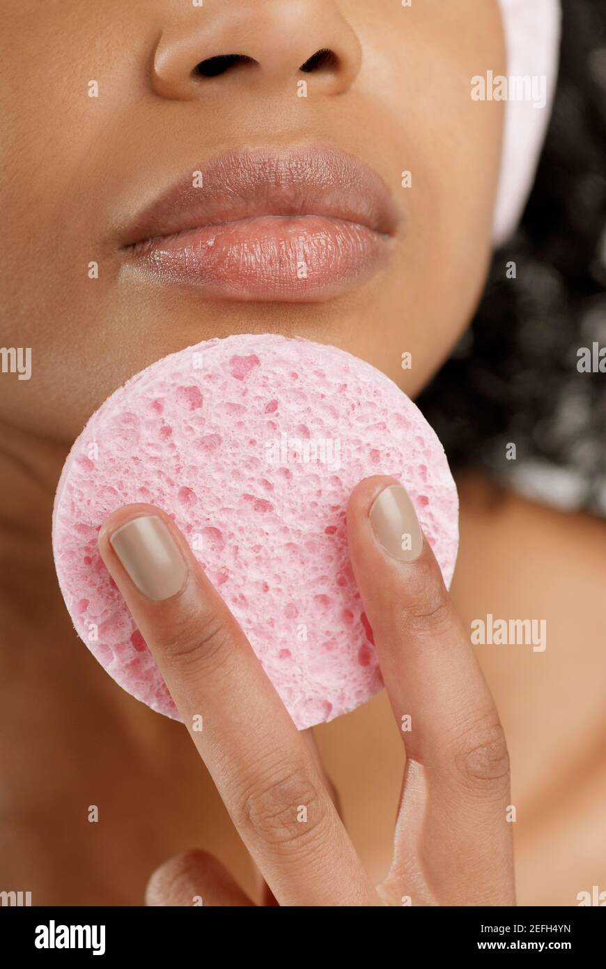 Beautiful woman applying powder using hi-res stock photography and ...