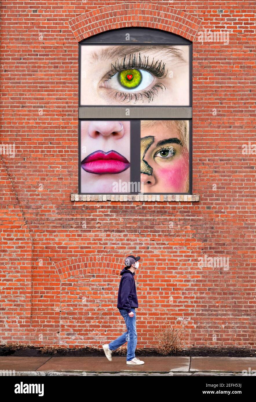 I'm watching you. A man walks beneath a window as a woman watches from above. Composite image. Stock Photo