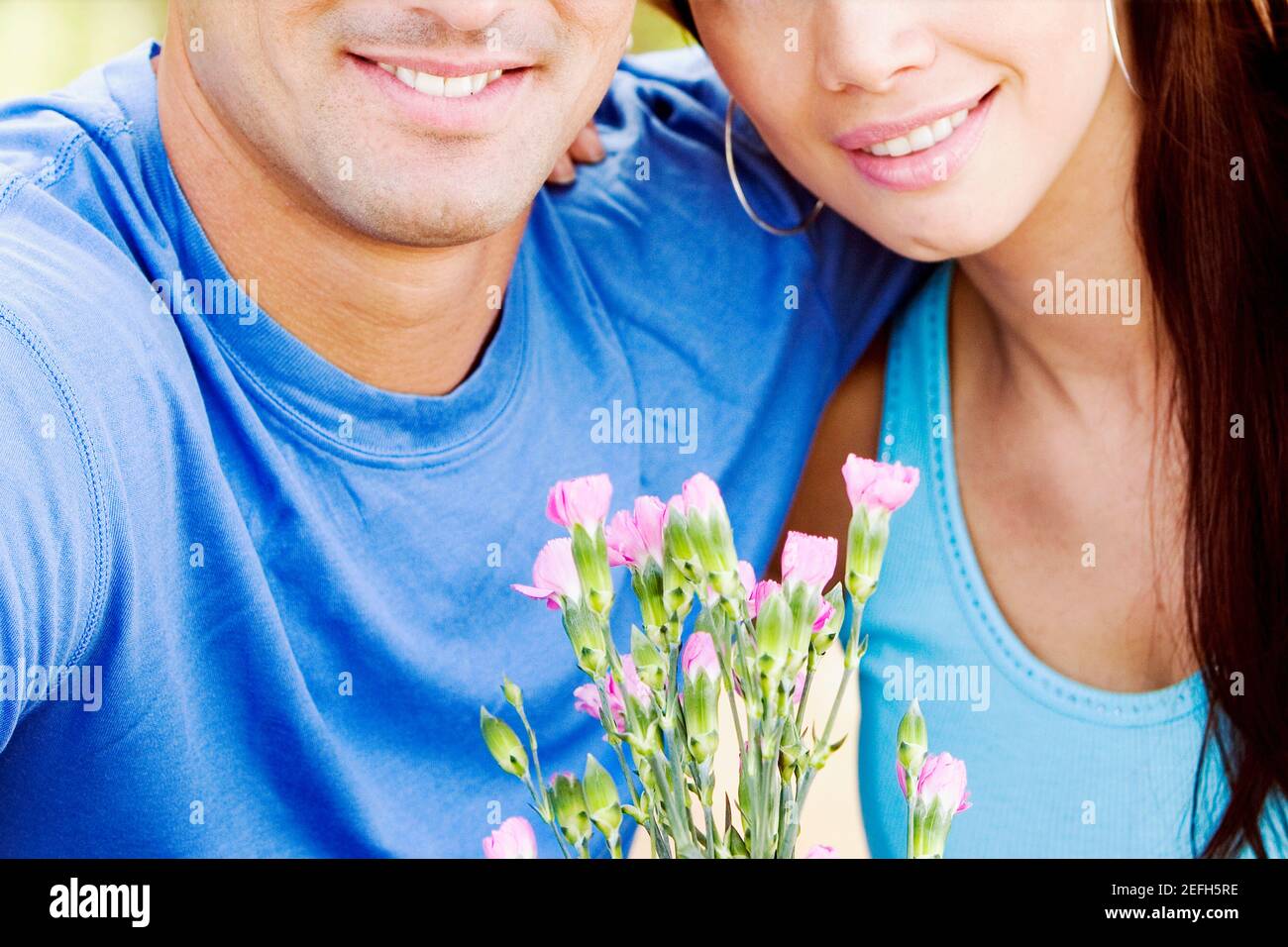 Hispanic young couple flowers hi-res stock photography and images - Alamy