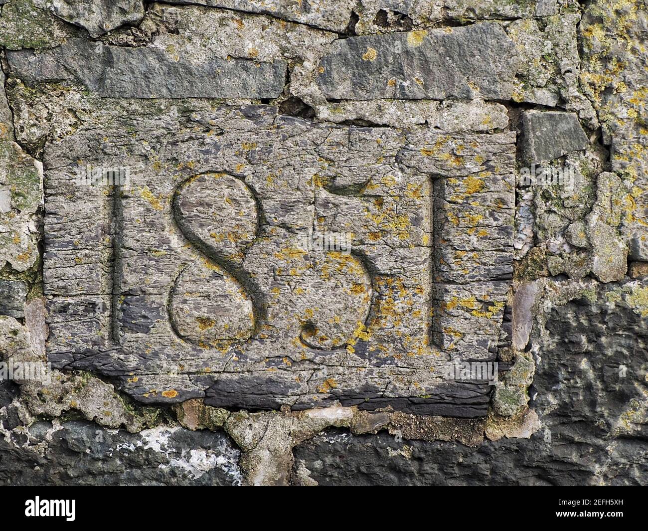 1851...carved date on the wall of Ballywalter harbour Stock Photo