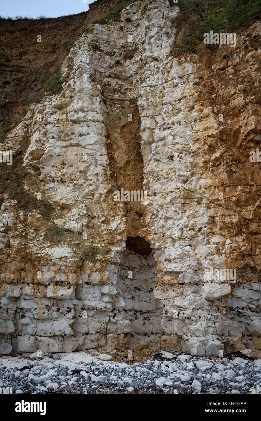 A solution hollow revealed by a collapse in the chalk cliffs between Hope Gap and Cuckmere Haven, East Sussex, UK Stock Photo