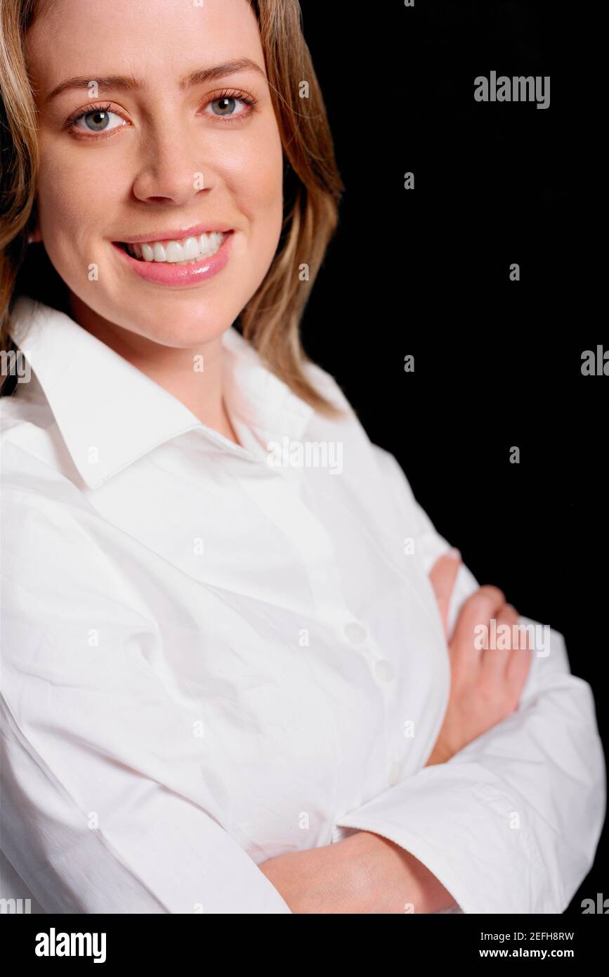 Portrait of a young woman smiling Stock Photo - Alamy