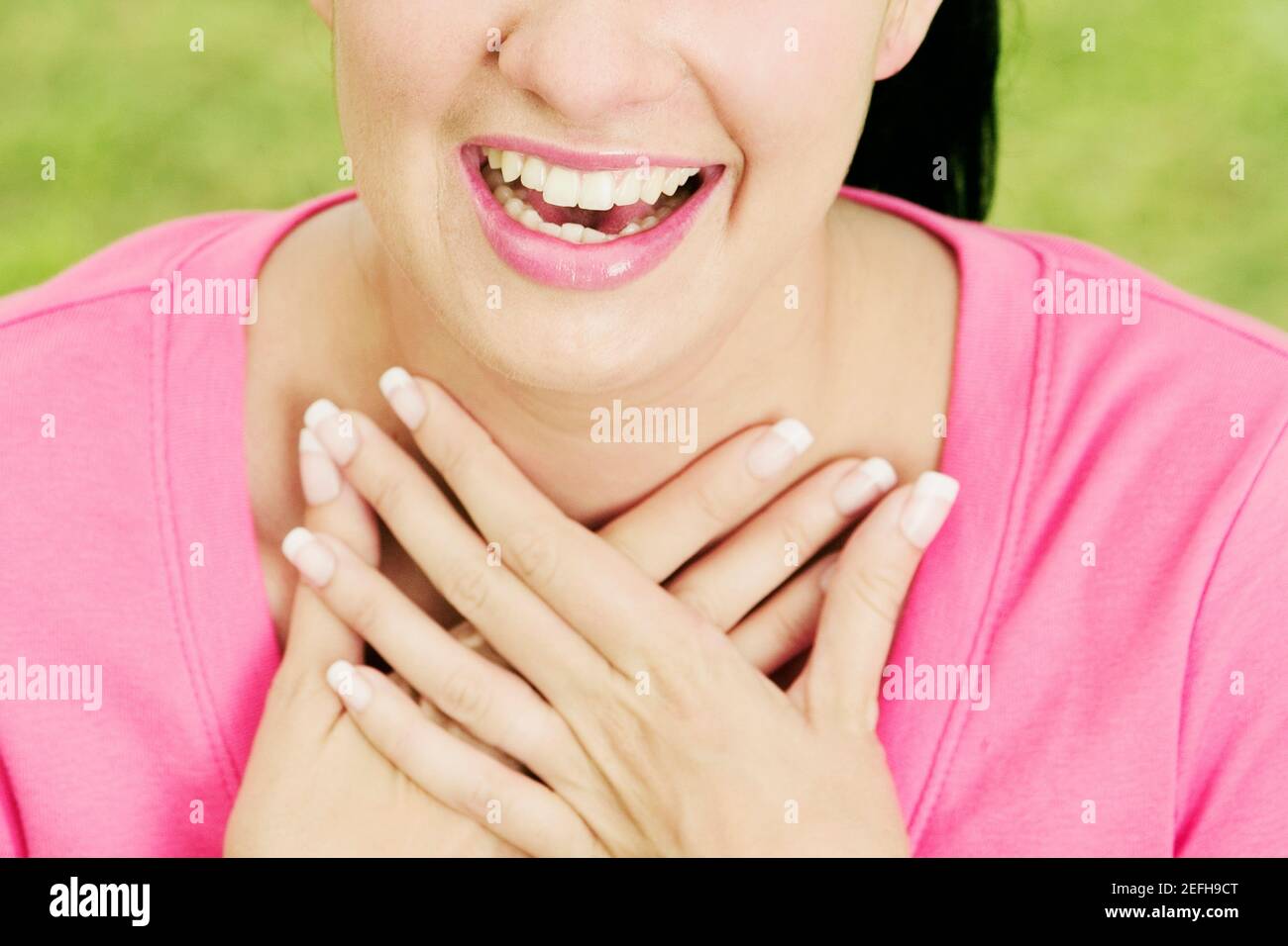 Mid section view of a young woman hugging herself Stock Photo - Alamy