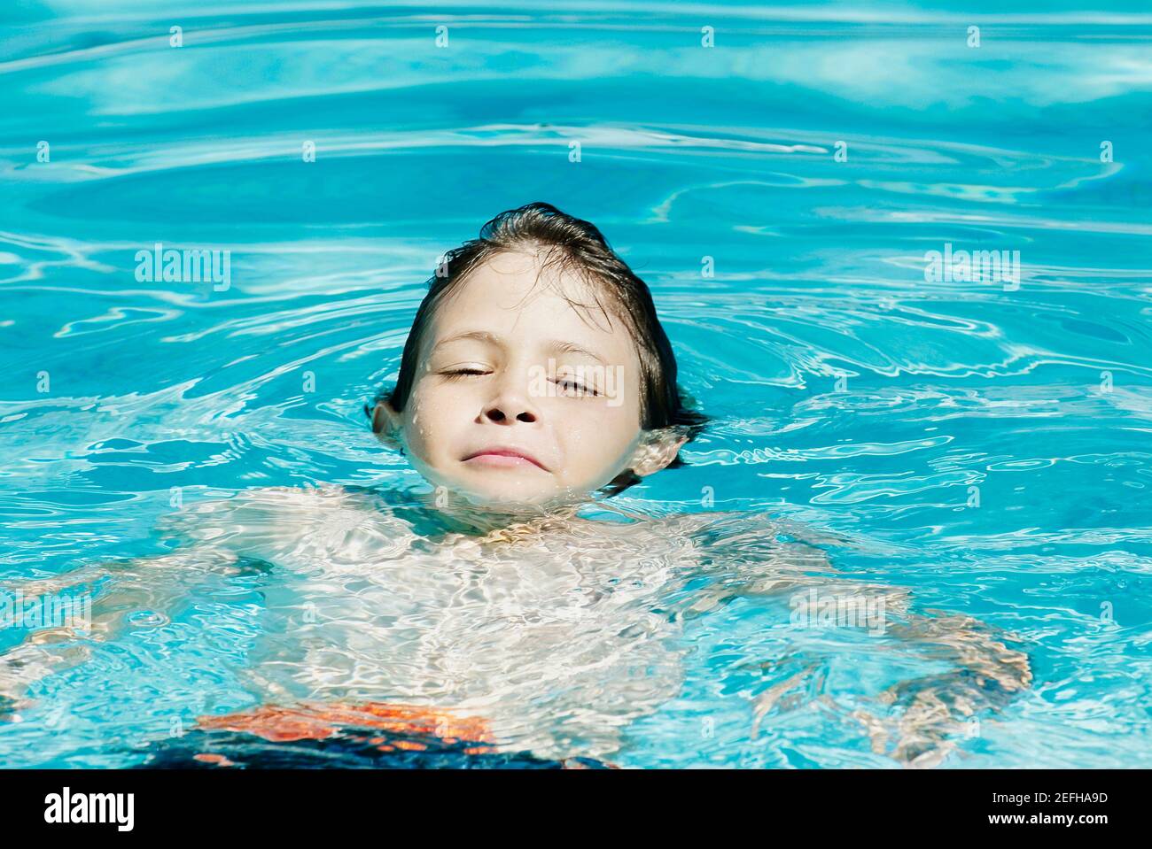 Boy swimming in a swimming pool Stock Photo Alamy