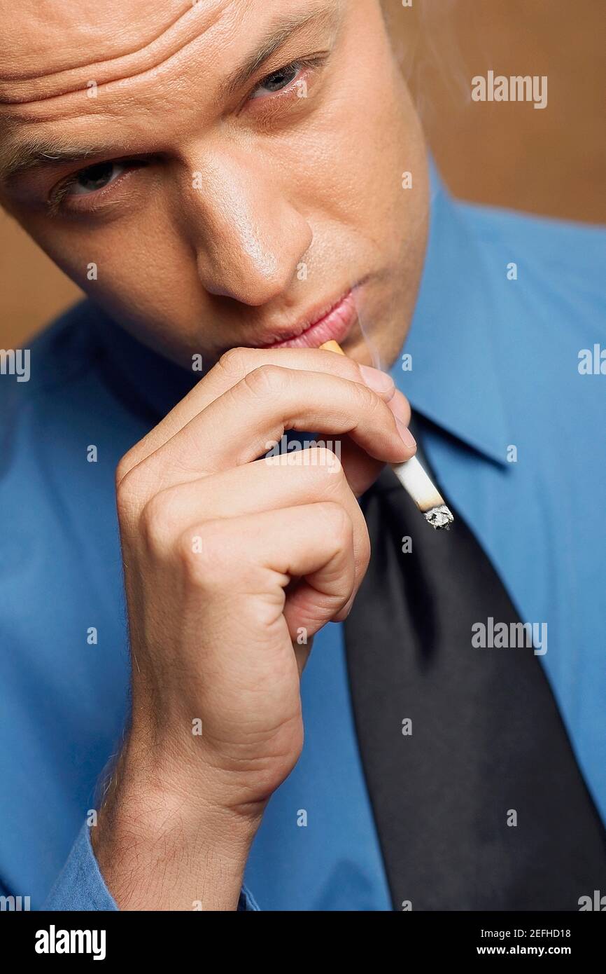 Portrait of a businessman smoking Stock Photo